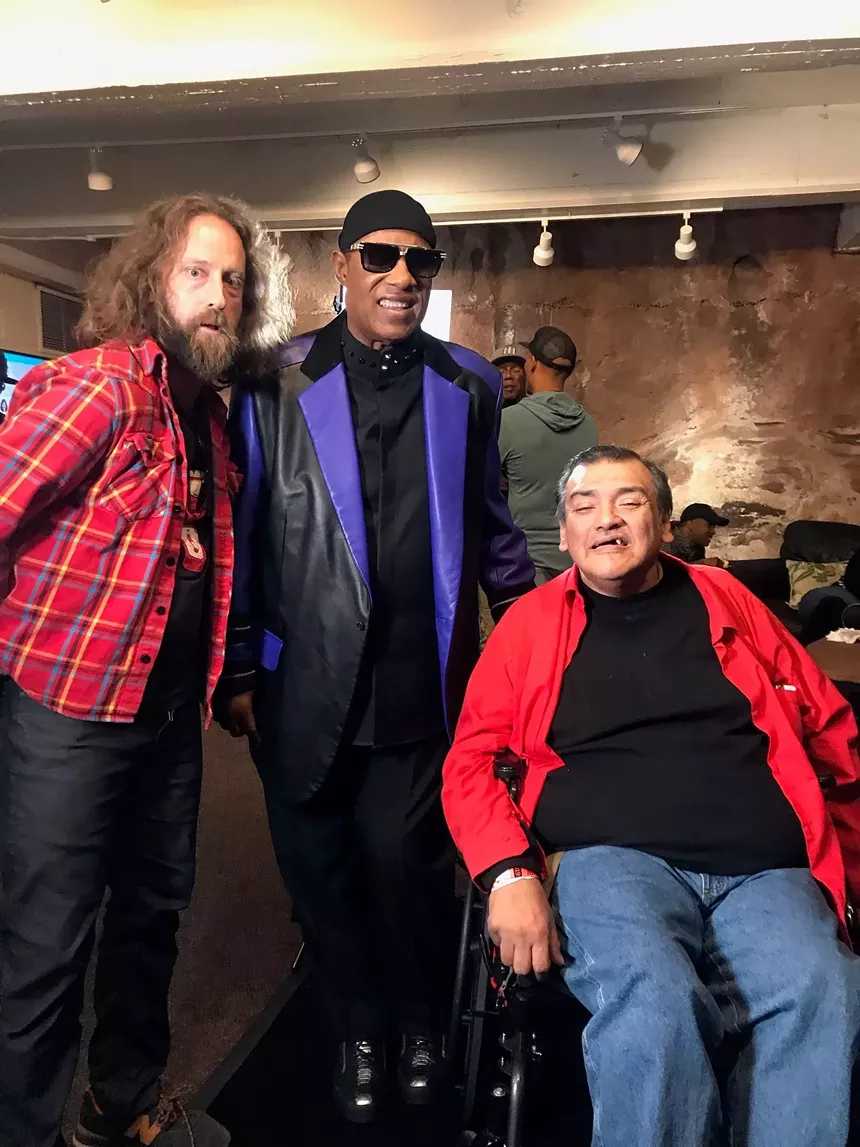 comedians smile for a picture
