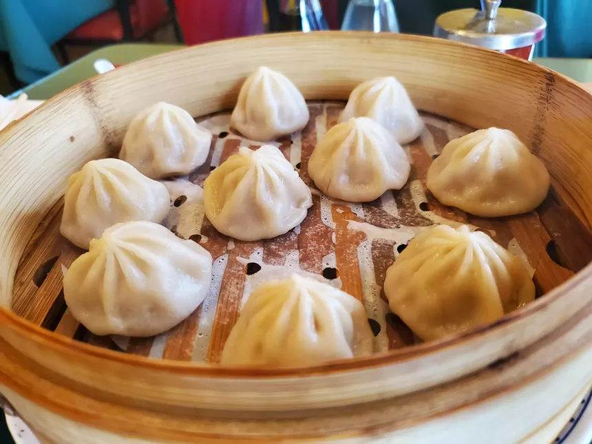 a steamer tray filled with dumplings