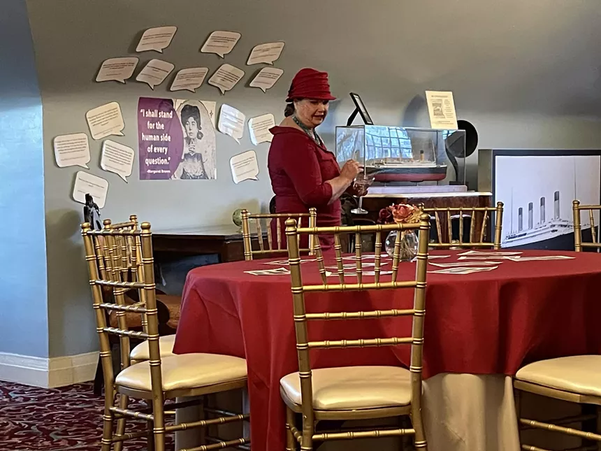 woman in red dress at table