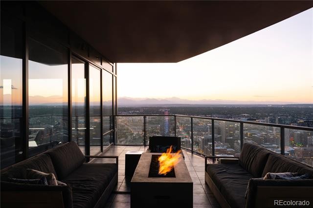 Condo deck with fireplace