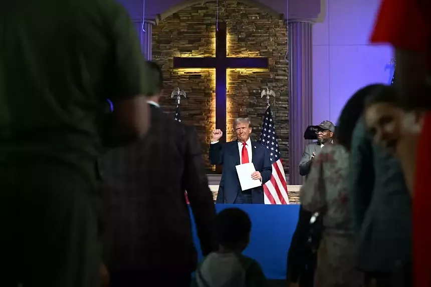 trump in front of church cross