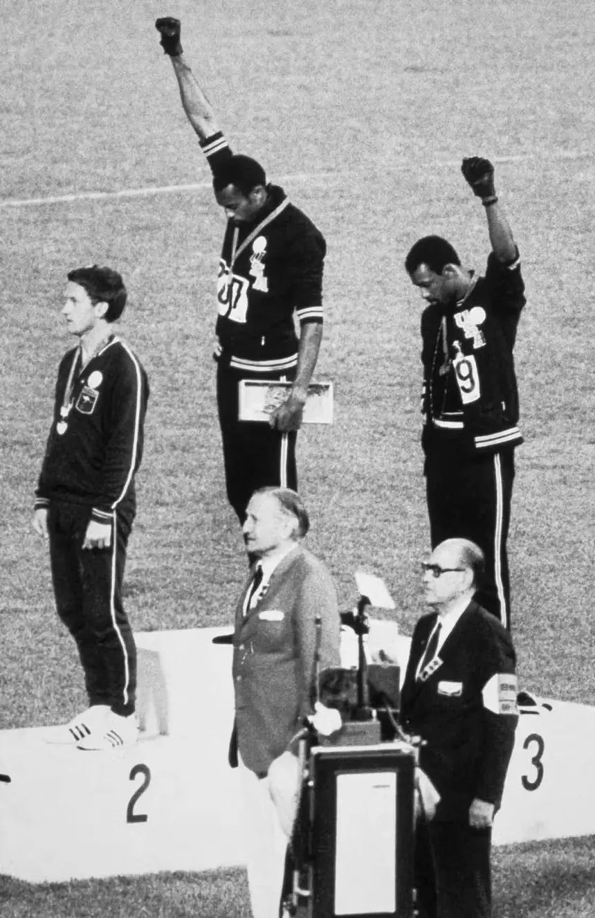 athletes with raised fists