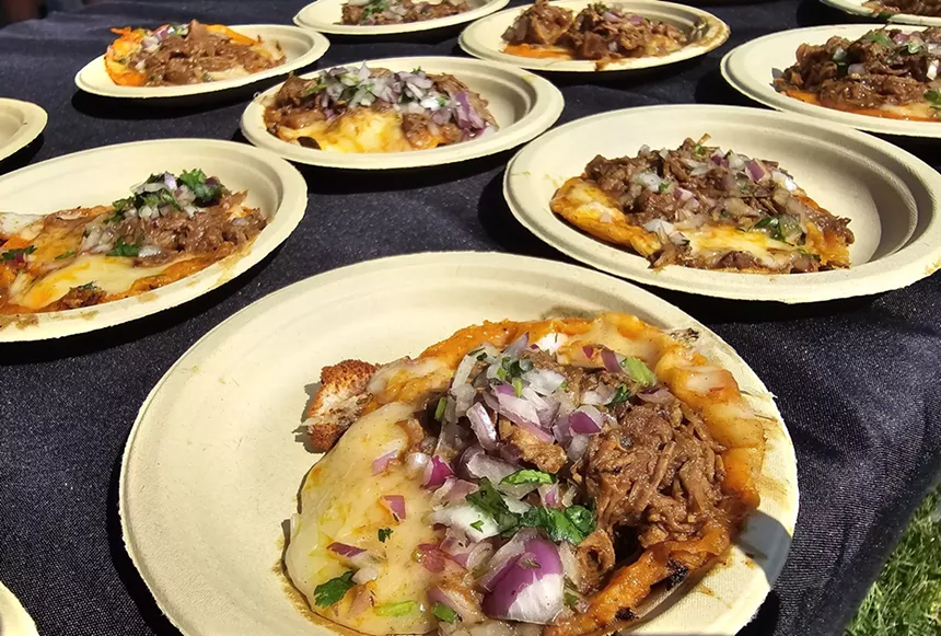 a beef taco with melted cheese