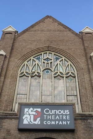 church with sign that says Curious Theatre