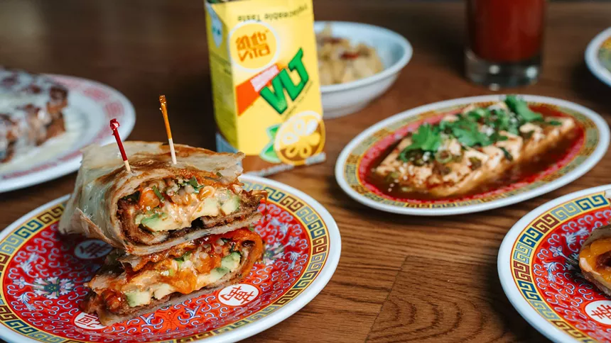 a breakfast sandwich wrapped in a scallion pancake