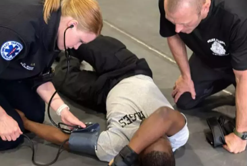 paramedics checking man