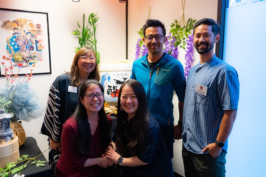 five people posing for a photo