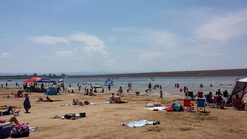 Groups of people on the swim beach at Cherry Creek State Park