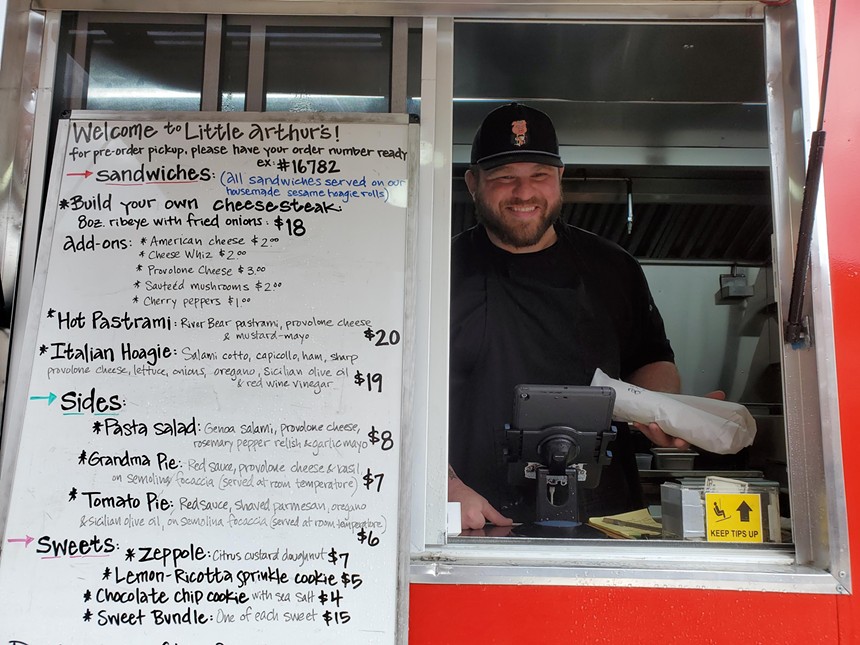 a man in a food truck window