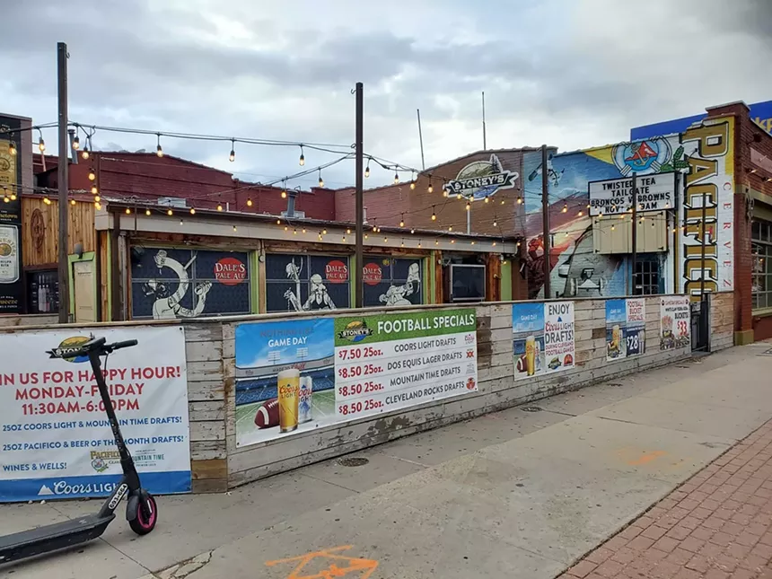 exterior of a bar patio with beer ads