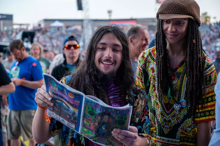 Phish fans reading a magazine