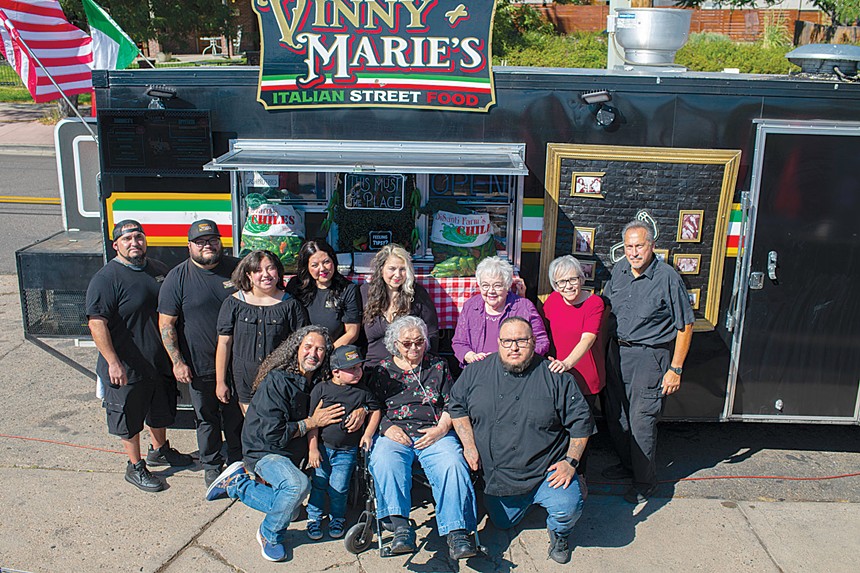 family in front of food truck