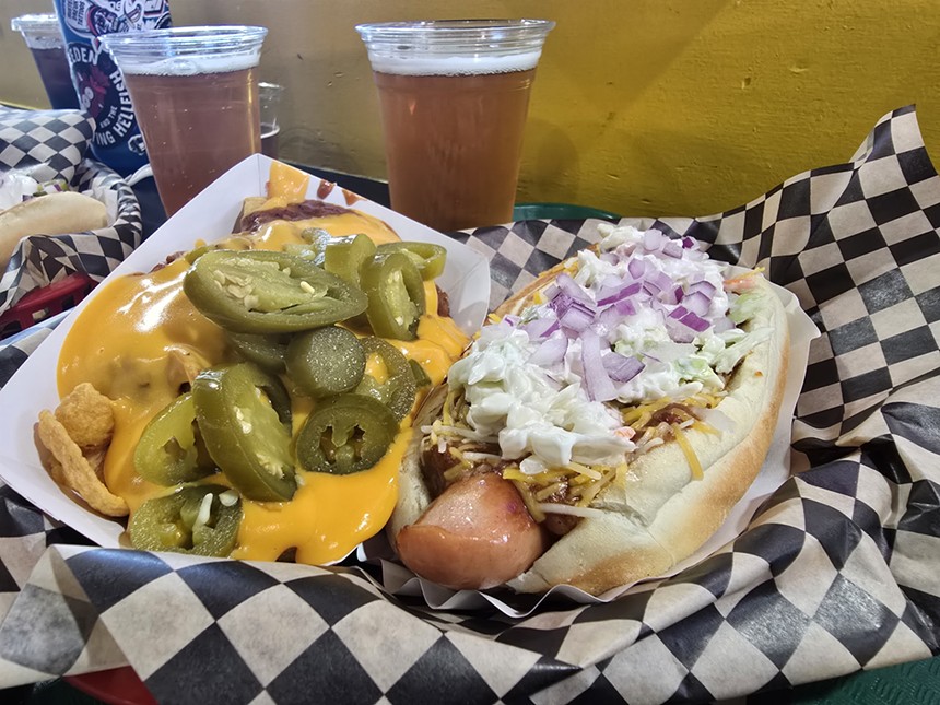 frito pie and a hot dog topped with cole slaw