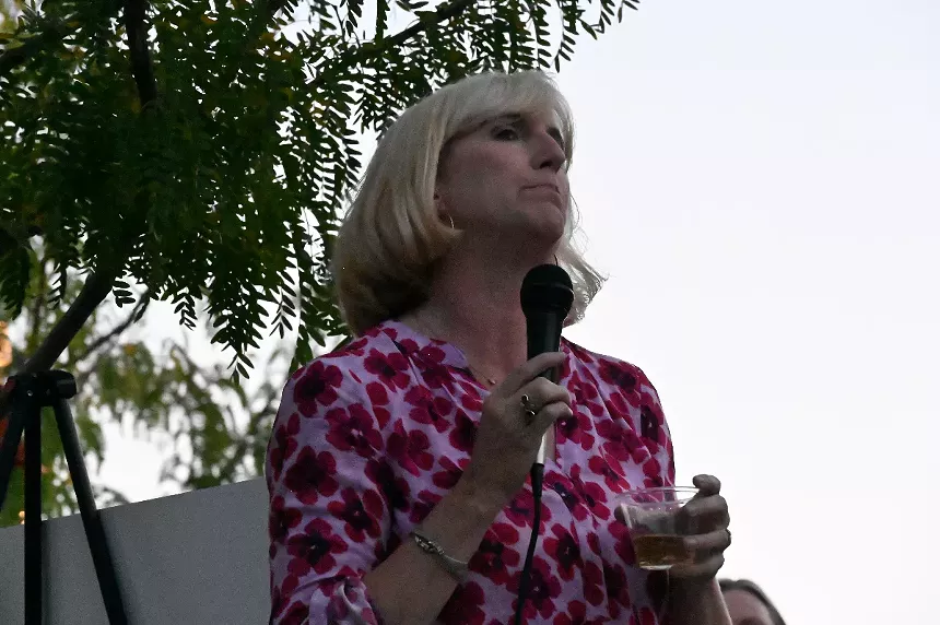 A woman gives a toast.