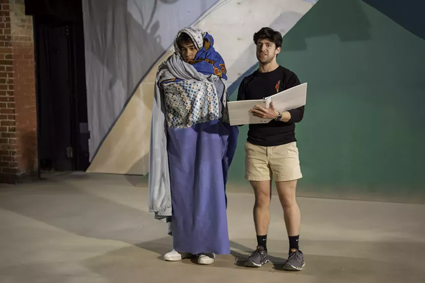 actors on set rehearsing Cannibal: The Musical