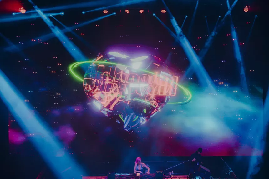 A photo showing a stage design and lights at a concert.