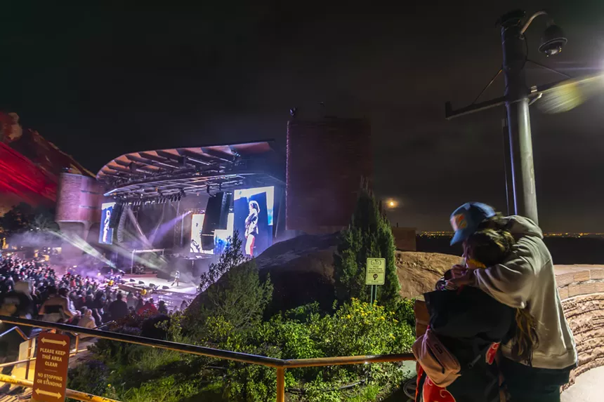 A photo showing two people enjoying the scene at Red Rocks.