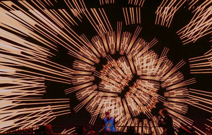 A photo showing a unique stage design graphic while Hamdi is performing at Red Rocks.