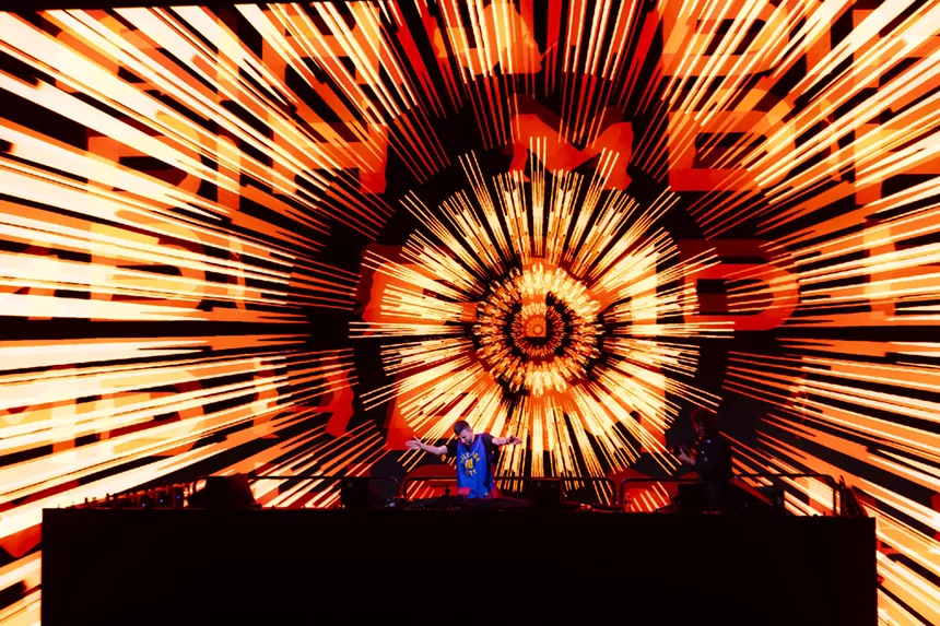 A photo showing a unique stage design graphic while Hamdi is performing at Red Rocks.