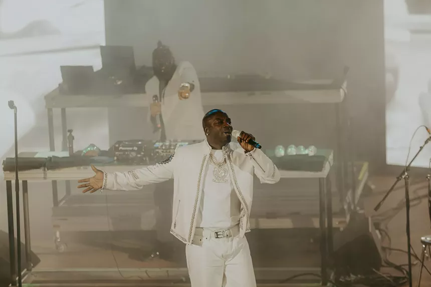 A photo of Akon on stage performing at Red Rocks in Morrison, Colorado.