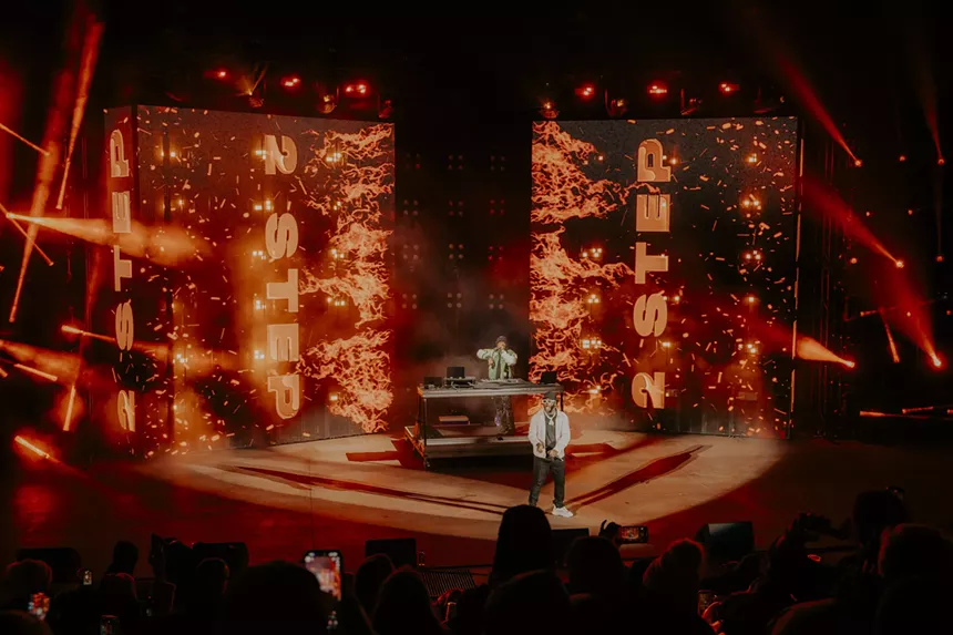 A photo of T-Pain on stage showing his stage design.