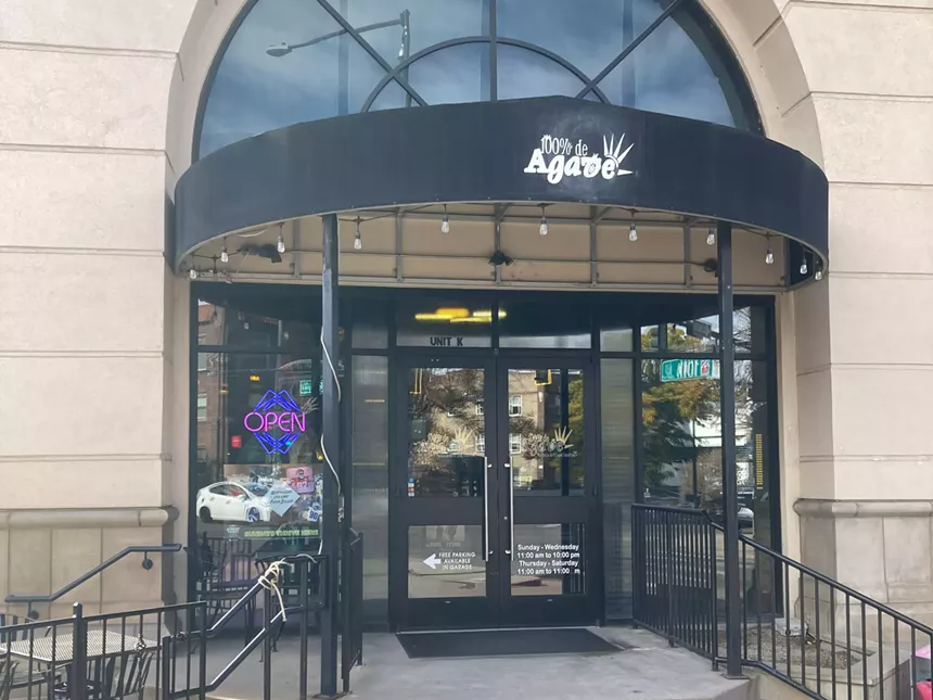 entryway with a black awning