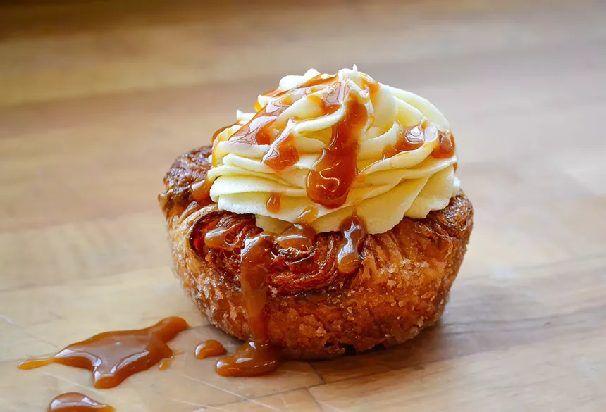 Izzio Bakery's pumpkin cream cheese kouign-amann drizzled with caramel
