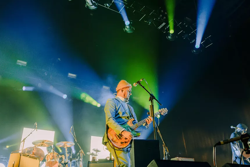 Isaac Brock of Modest Mouse performing on stage.
