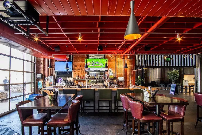 tables in front of a bar