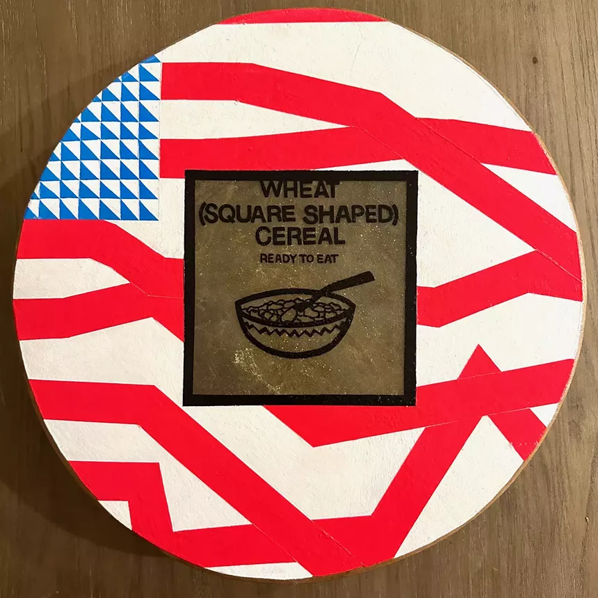 painted drum with an abstract American flag and food label