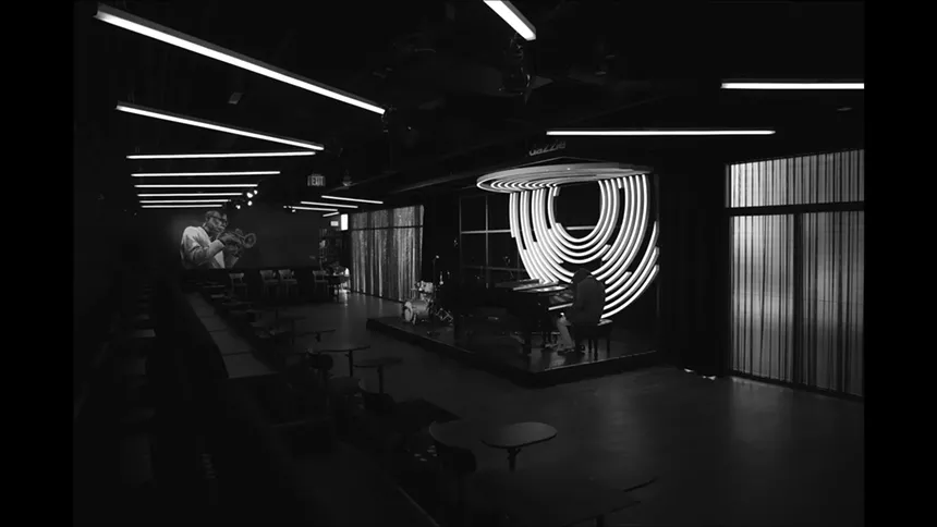 A black and white image of a jazz club.