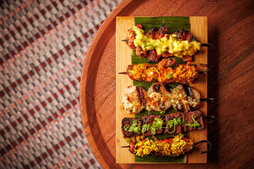 various skewers of meat, seafood and vegetables