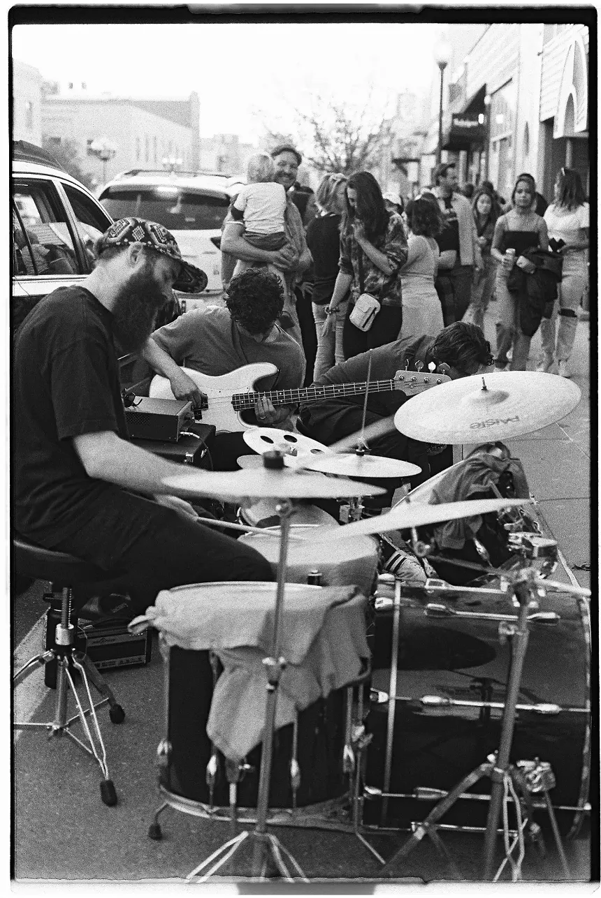 drums, bass player and saxophone player