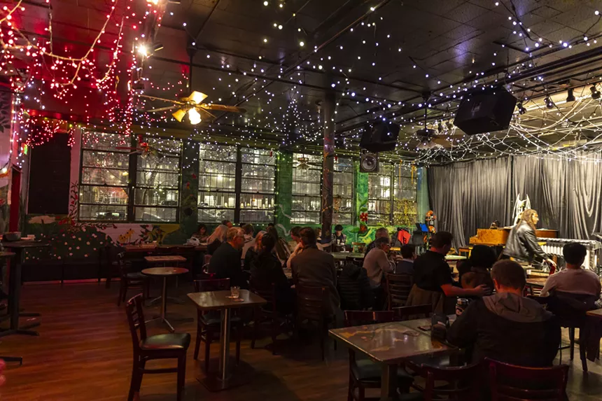 audience listening to jazz in dark club