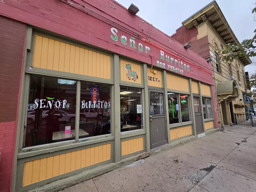 front of a building with a red awning