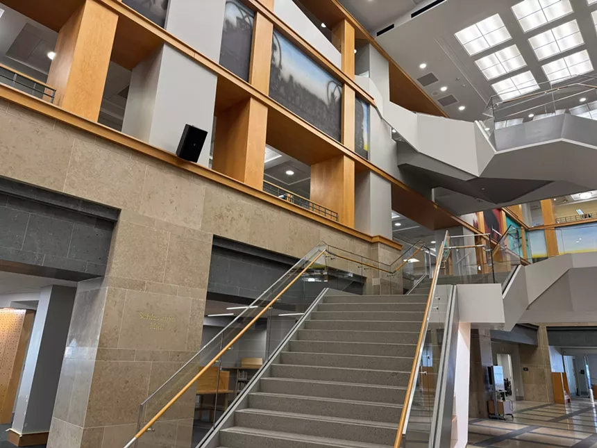 A modern, angular staircase in the Denver Central Library's main atrium