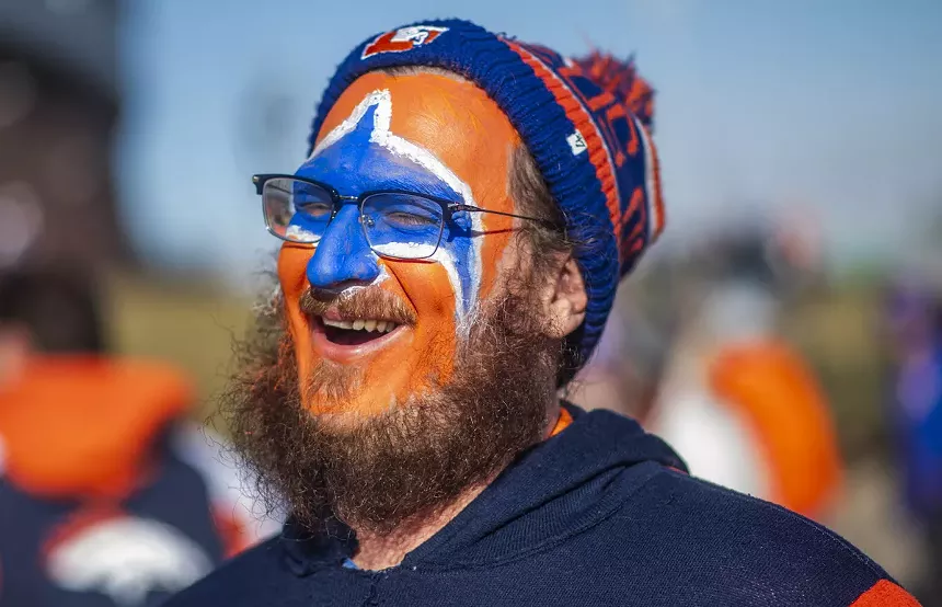 bronco fan dressed as WWF star