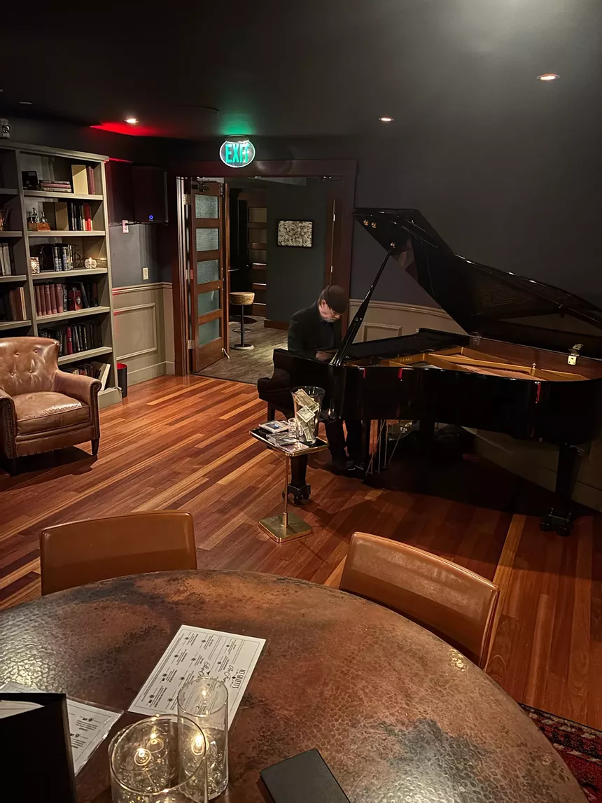 person playing piano inside
