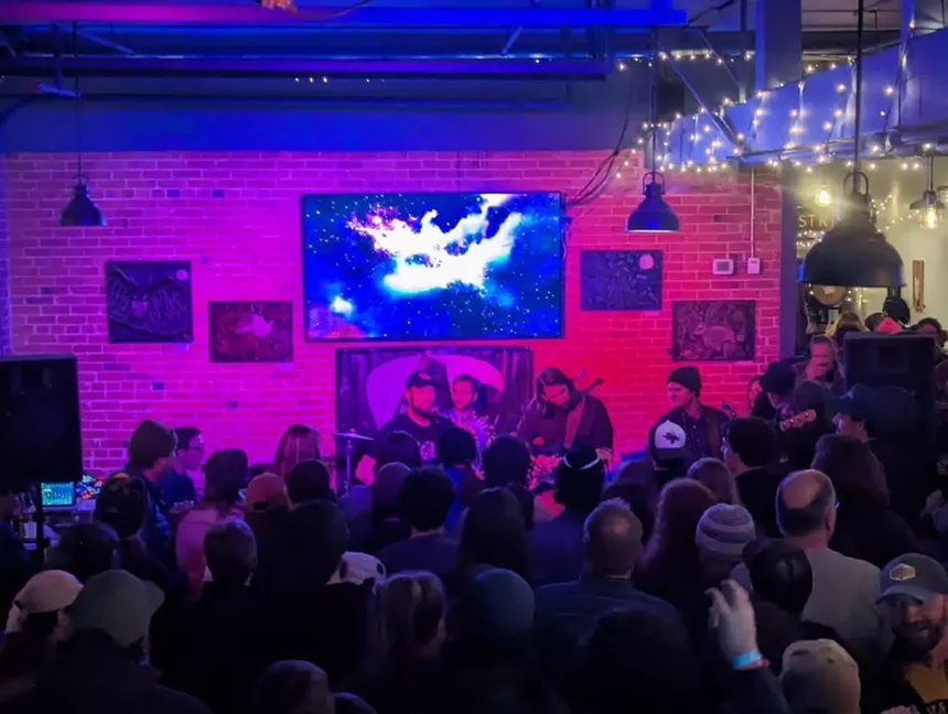 band performing in a brewery