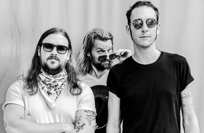 three men wearing sunglasses