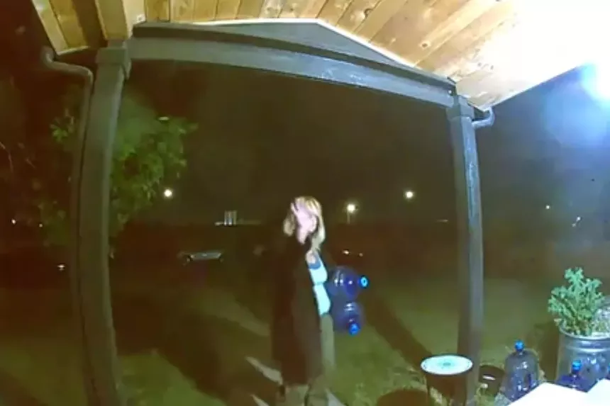 Woman steals water jugs on security camera