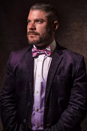 man in purple bow tie