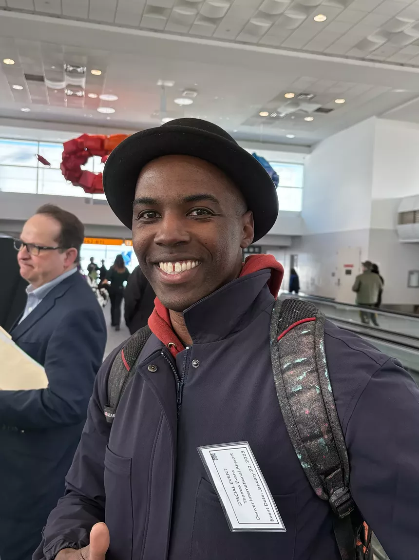 Black artist smiling for camera