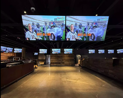 interior of a bar with big televisions