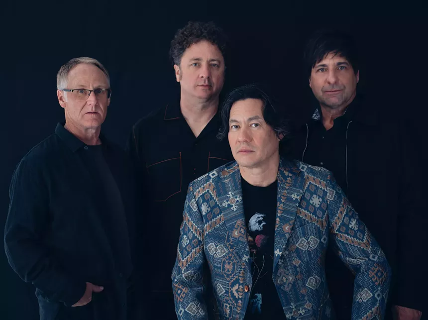 four men pose for a portrait photo