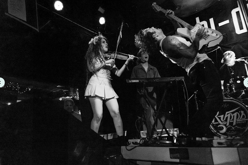 fiddle player and guitarist on stage