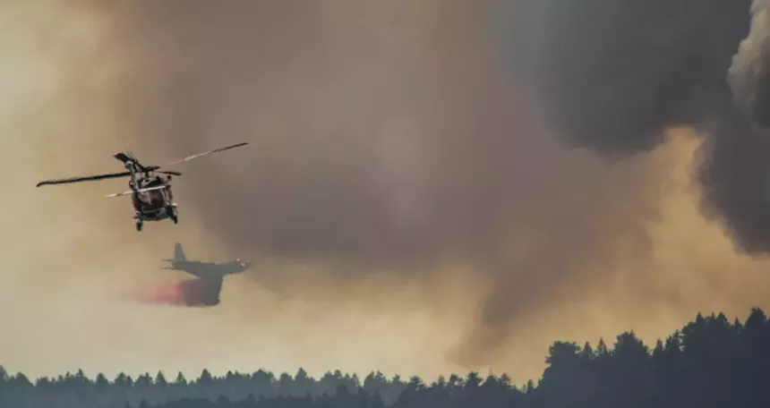 Fire department helicopter and tanker plane in Deer Creek Canyon fire