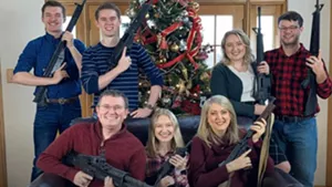 family by christmas tree