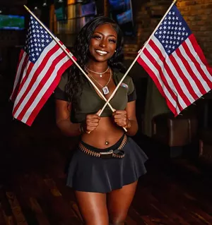 woman holding flags