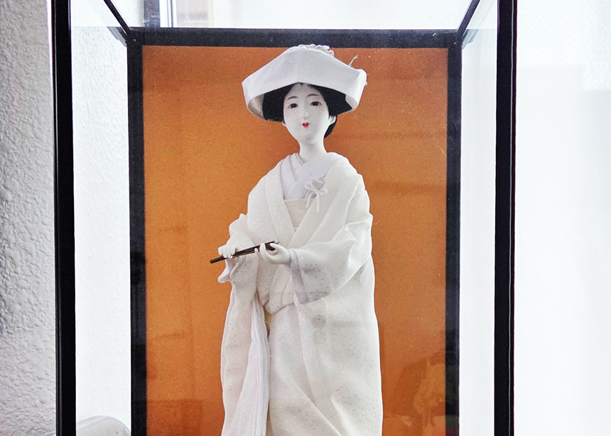 A white traditional Japanese doll figure